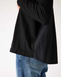 Moderne Pocket Crewneck Tee -Mersea Sales Store womens black front pocket pleated back crew neck long sleeve tee side view high low waist detail