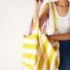 MerSea - Gemini Reversible Tote - Cabana Yellow (Add-On) -Mersea Sales Store womens cotton yellow striped solid pink reversible gemini beach tote with twill tie closure and interior slip pocket exterior striped side