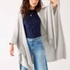 Charleston Travel Wrap 2 Charleston Travel Wrap -Mersea Sales Store womens light grey heathered cashmere lightweight travel wrap open front view hand on head