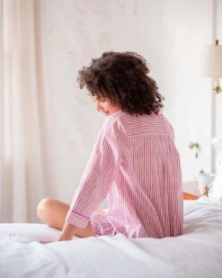 Over The Cotton Moon Nightshirt - Peony -Mersea Sales Store womens pink yellow and white stripe full button front patch pocket curved bottom hem night shirt bed view