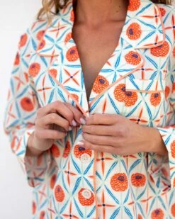 Over The Cotton Moon Pajama Set - Zinnias -Mersea Sales Store womens white blue orange zinnias print wide legged pajama set with pockets and ribbon tie button view