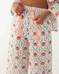 Over The Cotton Moon Pajama Set - Zinnias -Mersea Sales Store womens white blue orange zinnias print wide legged pajama set with pockets and ribbon tie waistband view