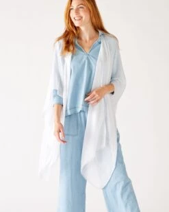 Nellie Wrap -Mersea Sales Store womens white breathable lightweight fringe hem multi functional nellie travel wrap front view shoulder drape