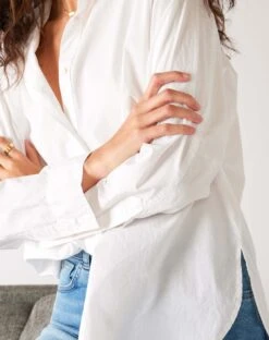 Brontë Relaxed Button Up Shirt -Mersea Sales Store womens white breathable relaxed fit button up shirt front view close up arms crossed