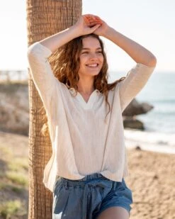 Catalina Polo Sweater -Mersea Sales Store womens white heathered collared v neck polo sweater front view travel destination look hands on head